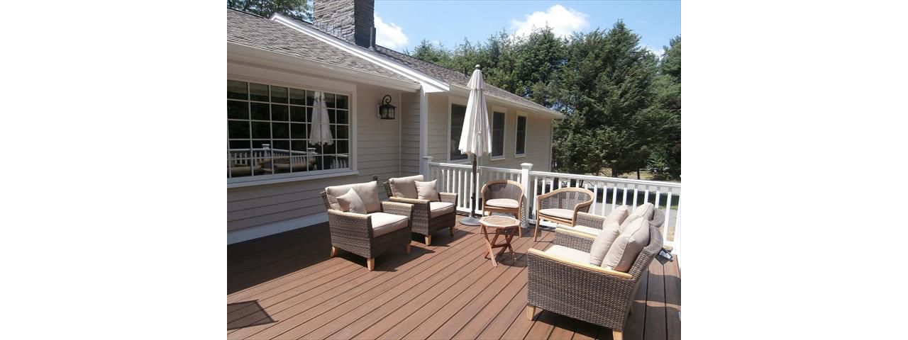 This new Trex Spiced Rum deck and white railing, created a whole new outdoor space that never existed before.