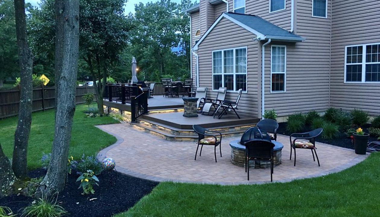 Multilevel Trex deck enclosed with stone in Sicklerville NJ