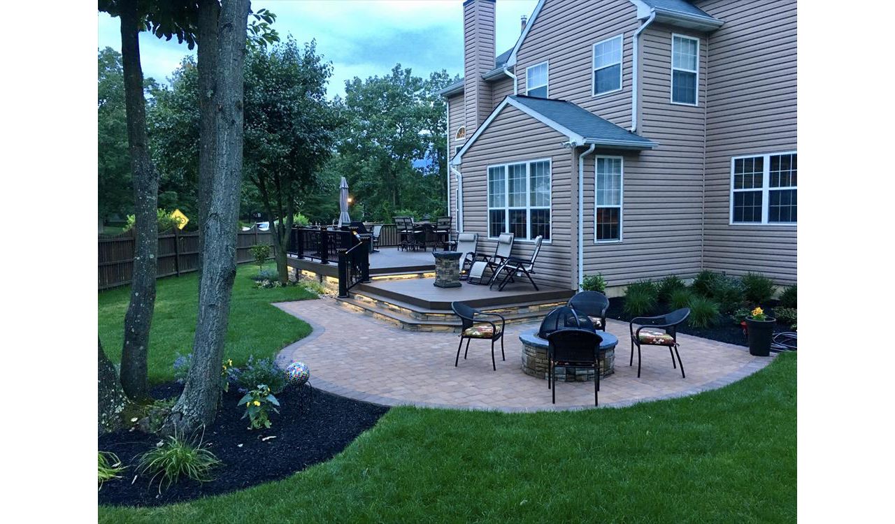 Multilevel Trex deck enclosed with stone in Sicklerville NJ