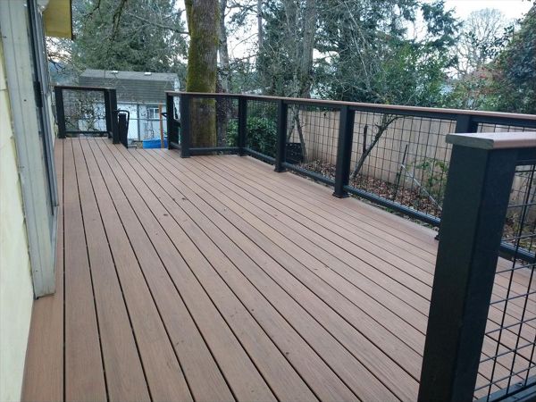 Trex Savanna Gold Decking, Lava Rock accents, Transcend Cocktail Rail with Wire panelinfill