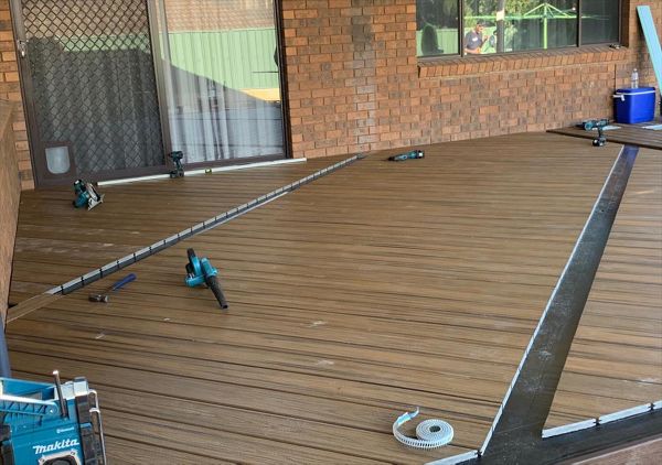 The new deck under construction. The owners chose Havana Gold for the main deck with Lava Rock fascia