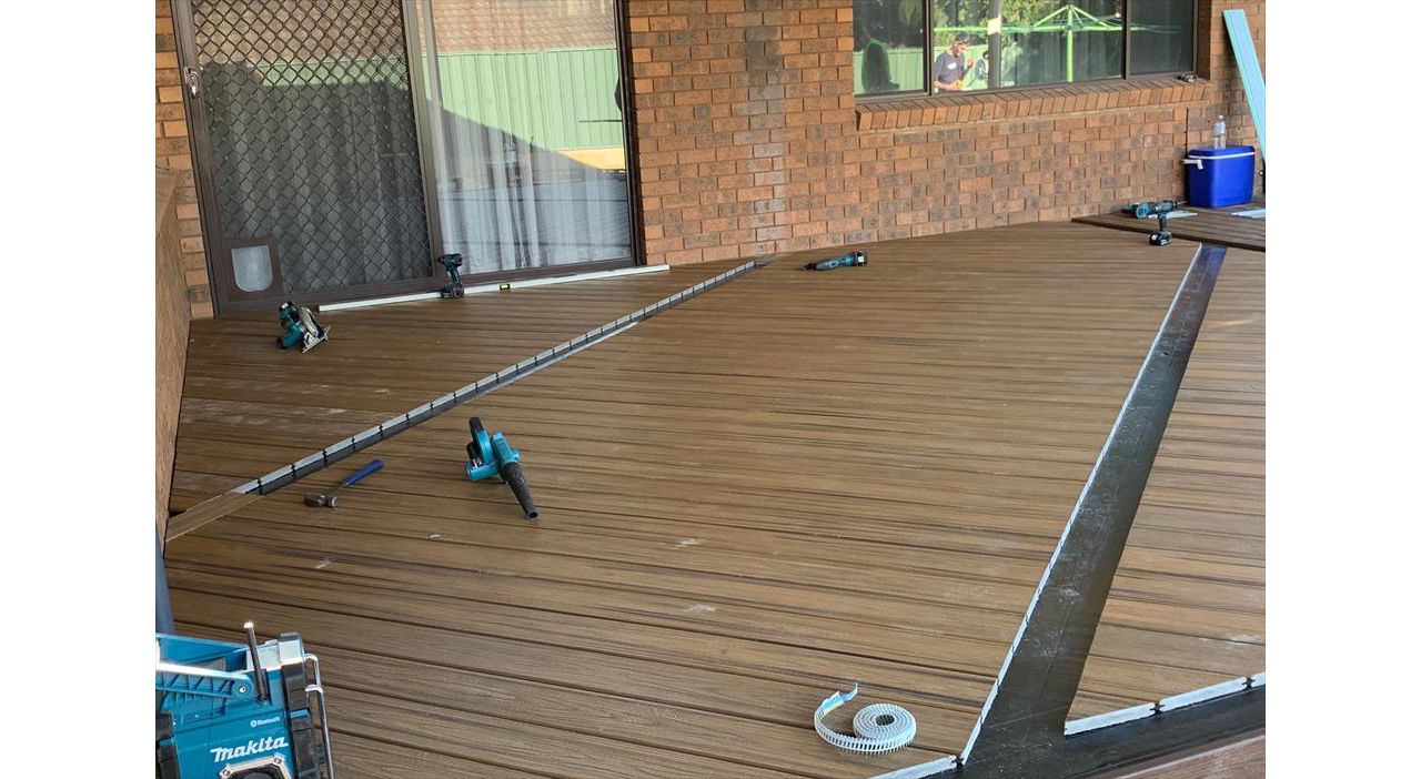 The new deck under construction. The owners chose Havana Gold for the main deck with Lava Rock fascia