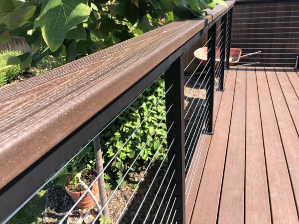 Tiki Torch Trex Transcend with stainless steel cable railing Trex cocktail rail Atascadero