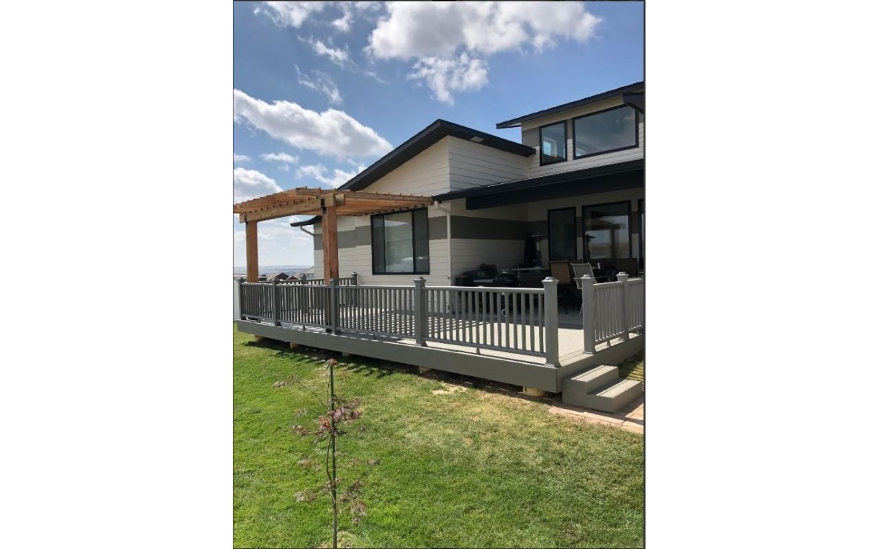 12'x29' Trex deck with a Cedar Pergola. The color of the decking is Trex Transcend Gravel Path and the Railing is Trex Transcend Gravel Path.