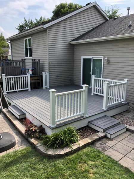 This deck features all white Trex transcend railing and fascia. It consists of Trex Transcend island mist decking