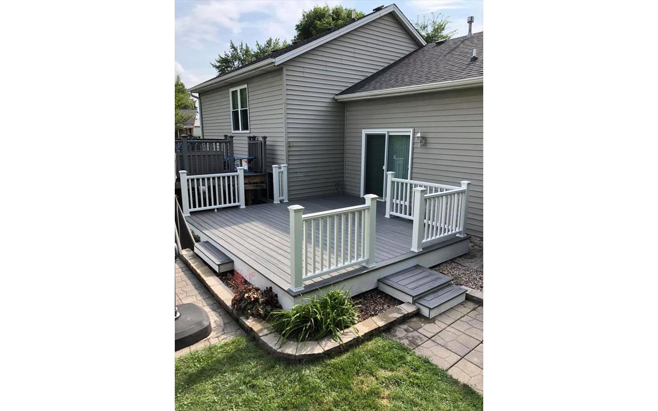 This deck features all white Trex transcend railing and fascia. It consists of Trex Transcend island mist decking