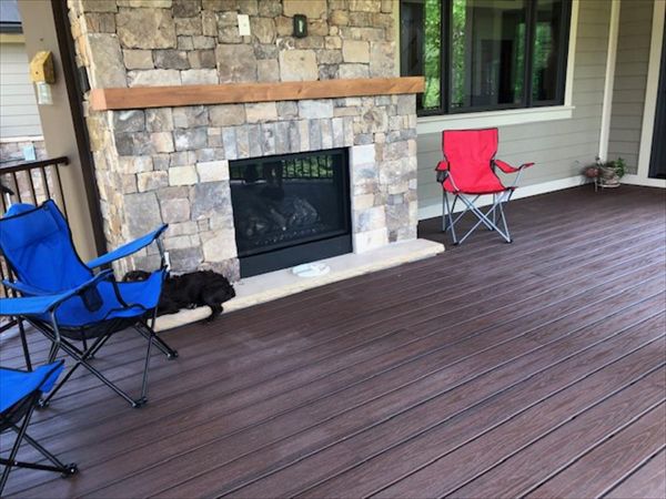 Trex Transcend Lava Rock deck looks perfect with this stone fireplace
