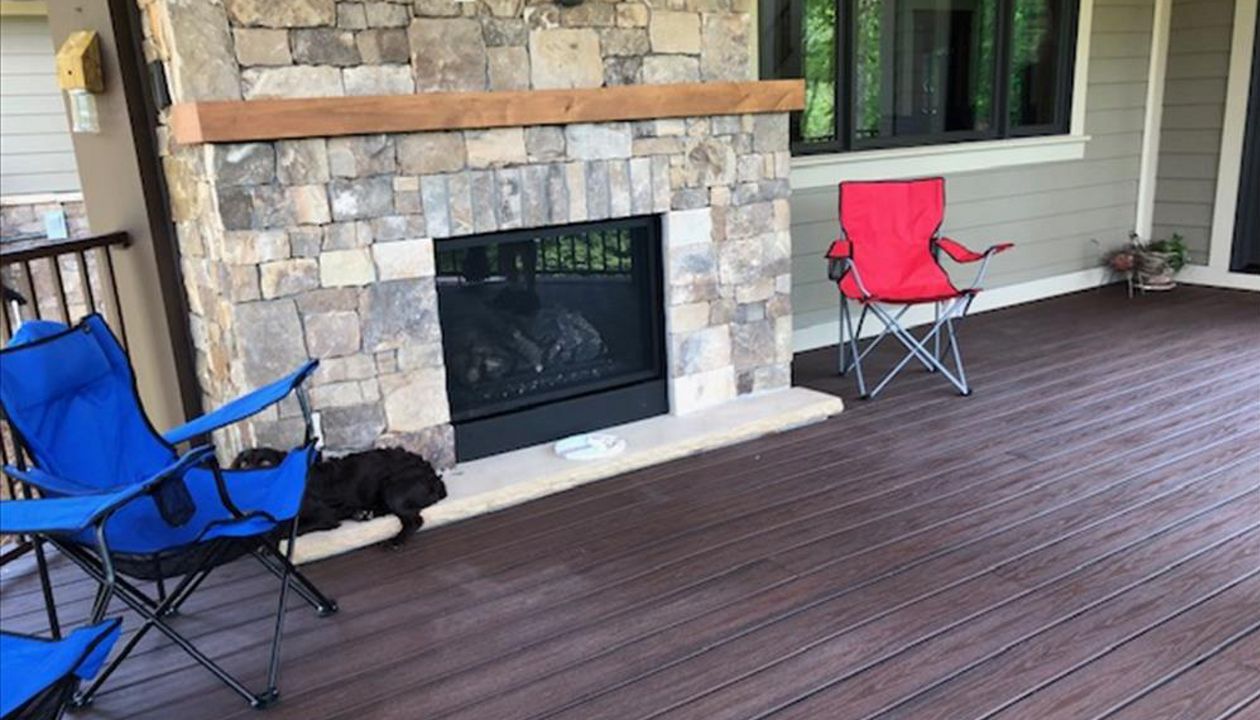 Trex Transcend Lava Rock deck looks perfect with this stone fireplace