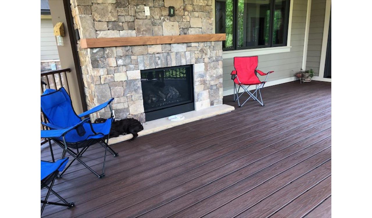 Trex Transcend Lava Rock deck looks perfect with this stone fireplace
