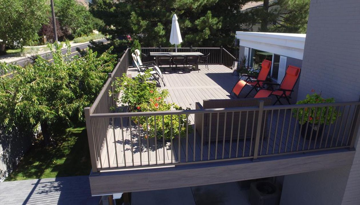 clam shell deck with trex rainescape and soffit underlay for rv parking