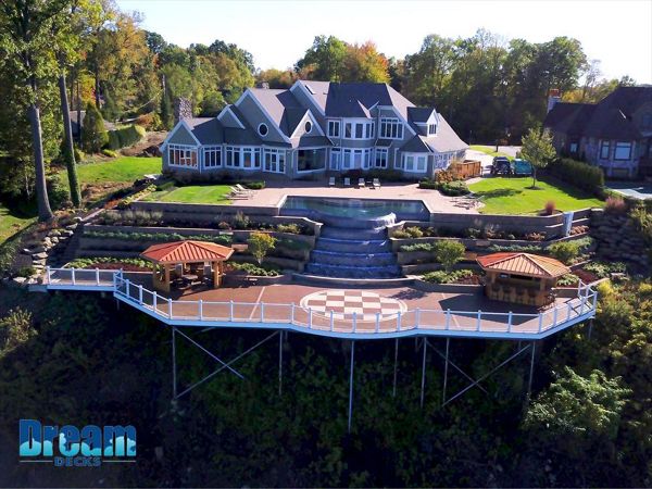 Expansive elevated Trex deck with elegant design for outdoor gatherings.