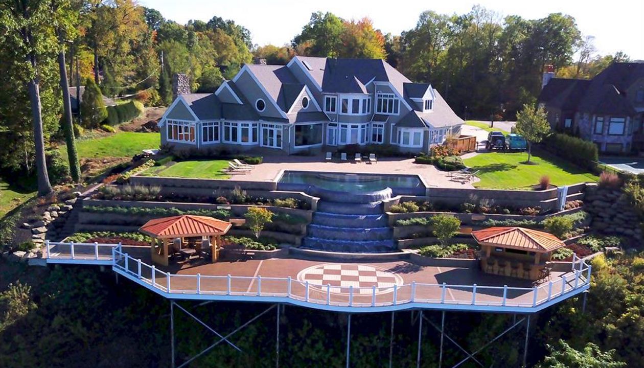 Expansive elevated Trex deck with elegant design for outdoor gatherings.