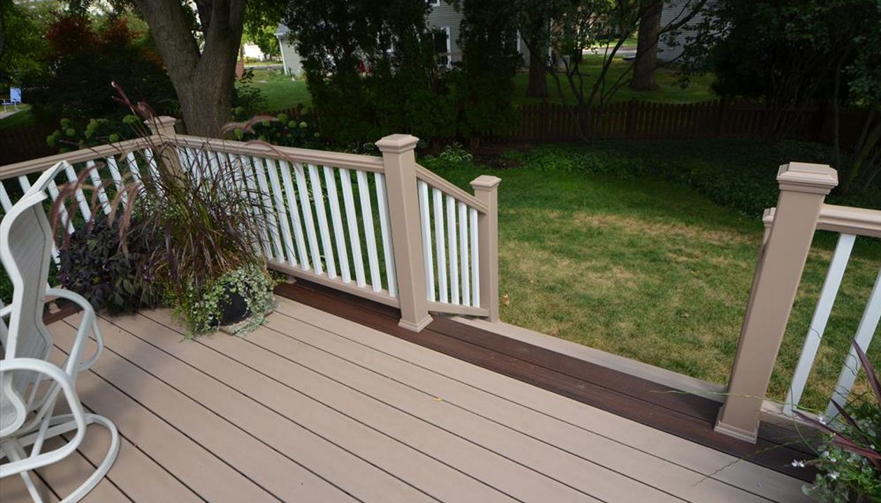 Trex Transcend Rope Swing Decking and Railing with Lava Rock Border -