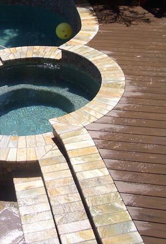 Composite deck around pool and jacuzzi