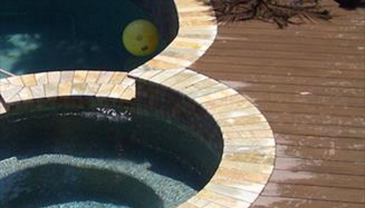 Composite deck around pool and jacuzzi