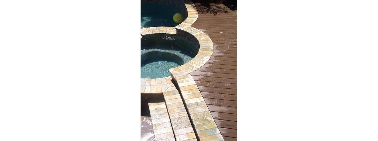 Composite deck around pool and jacuzzi
