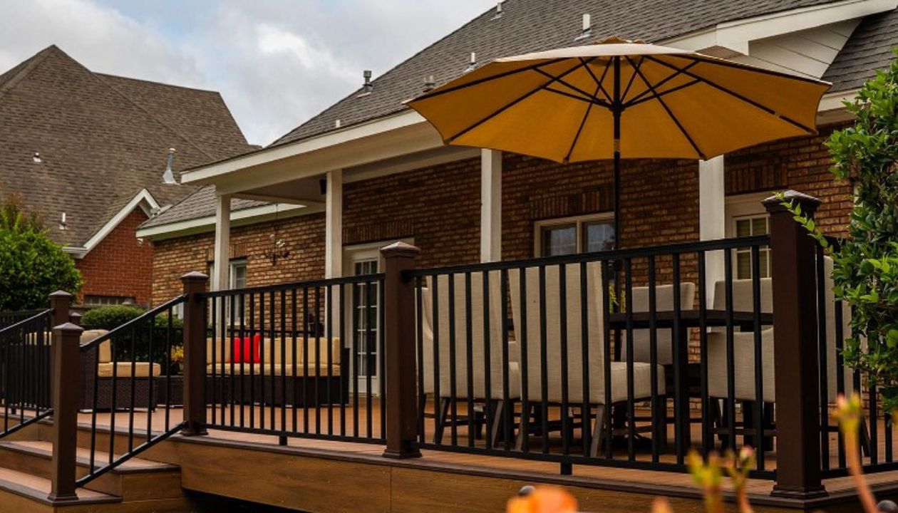 Trex Transcend Tiki Torch with Lava Rock decking and Vintage Lantern Railing