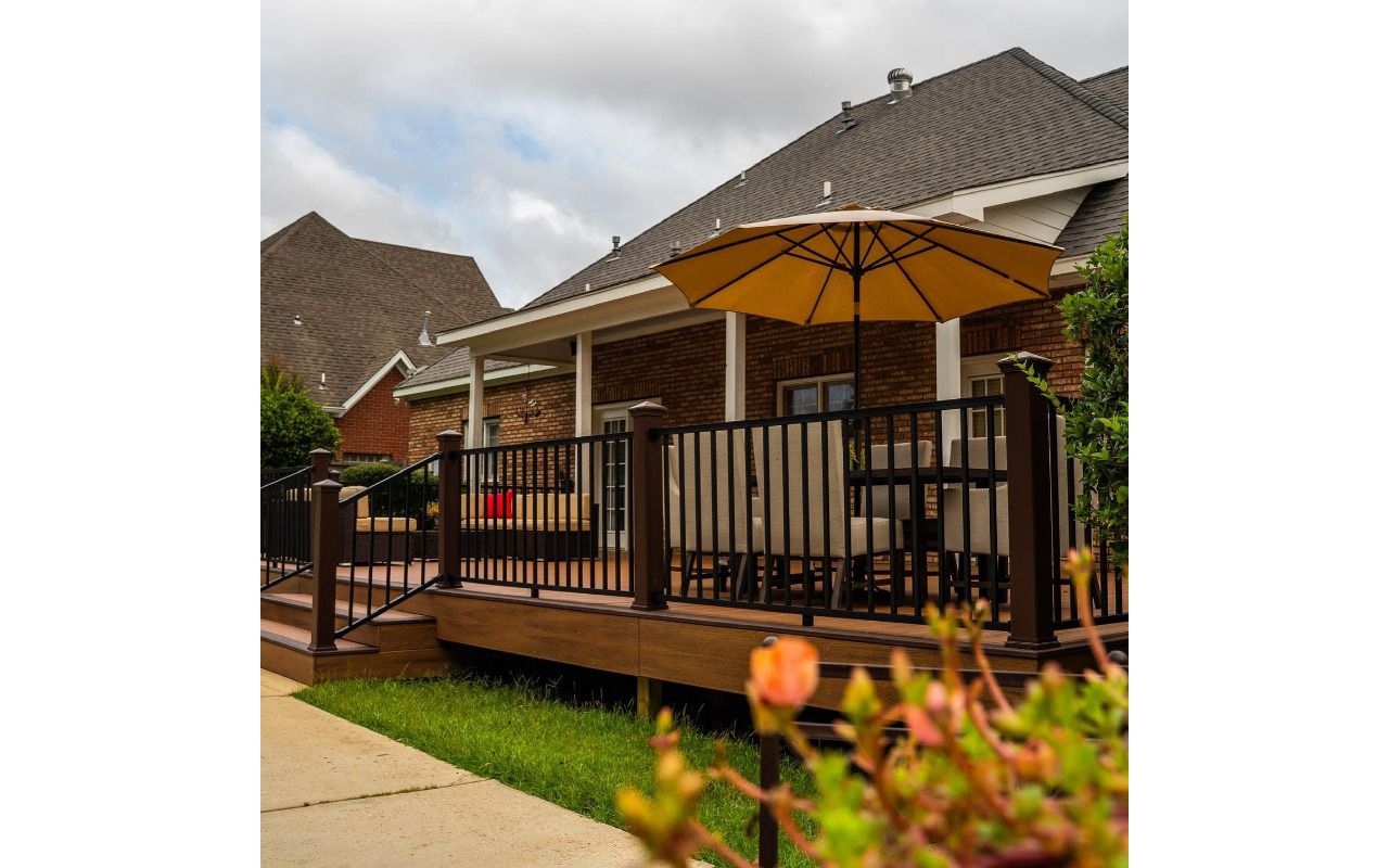 Trex Transcend Tiki Torch with Lava Rock decking and Vintage Lantern Railing