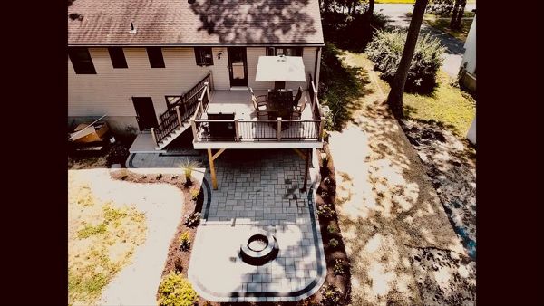 Trex Rope Swing with Vintage Lantern Horizontal Top/Bottom Rails and Rain Escapes system to create dry patio space below