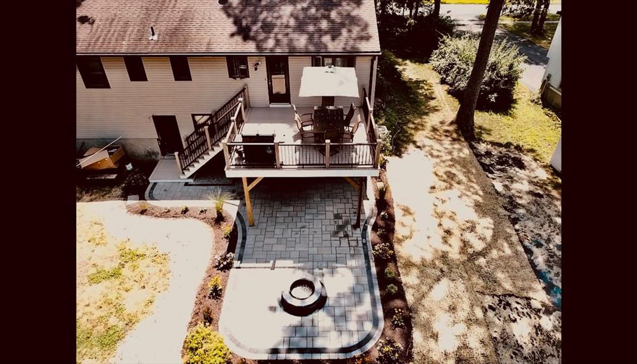 Trex Rope Swing with Vintage Lantern Horizontal Top/Bottom Rails and Rain Escapes system to create dry patio space below