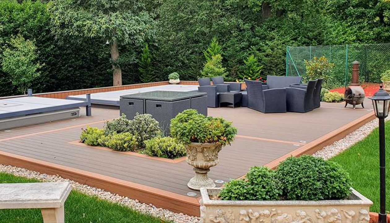 Trex Transcend Tiki Torch and Trex Transcend Spiced Rum Decking with Swimspa and hot tub in St George's hill , England UK