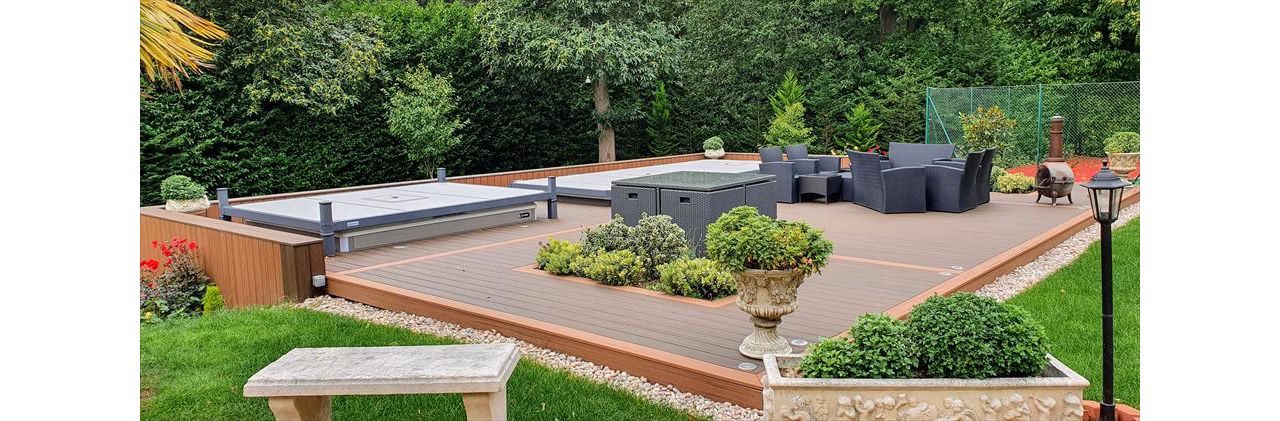 Trex Transcend Tiki Torch and Trex Transcend Spiced Rum Decking with Swimspa and hot tub in St George's hill , England UK