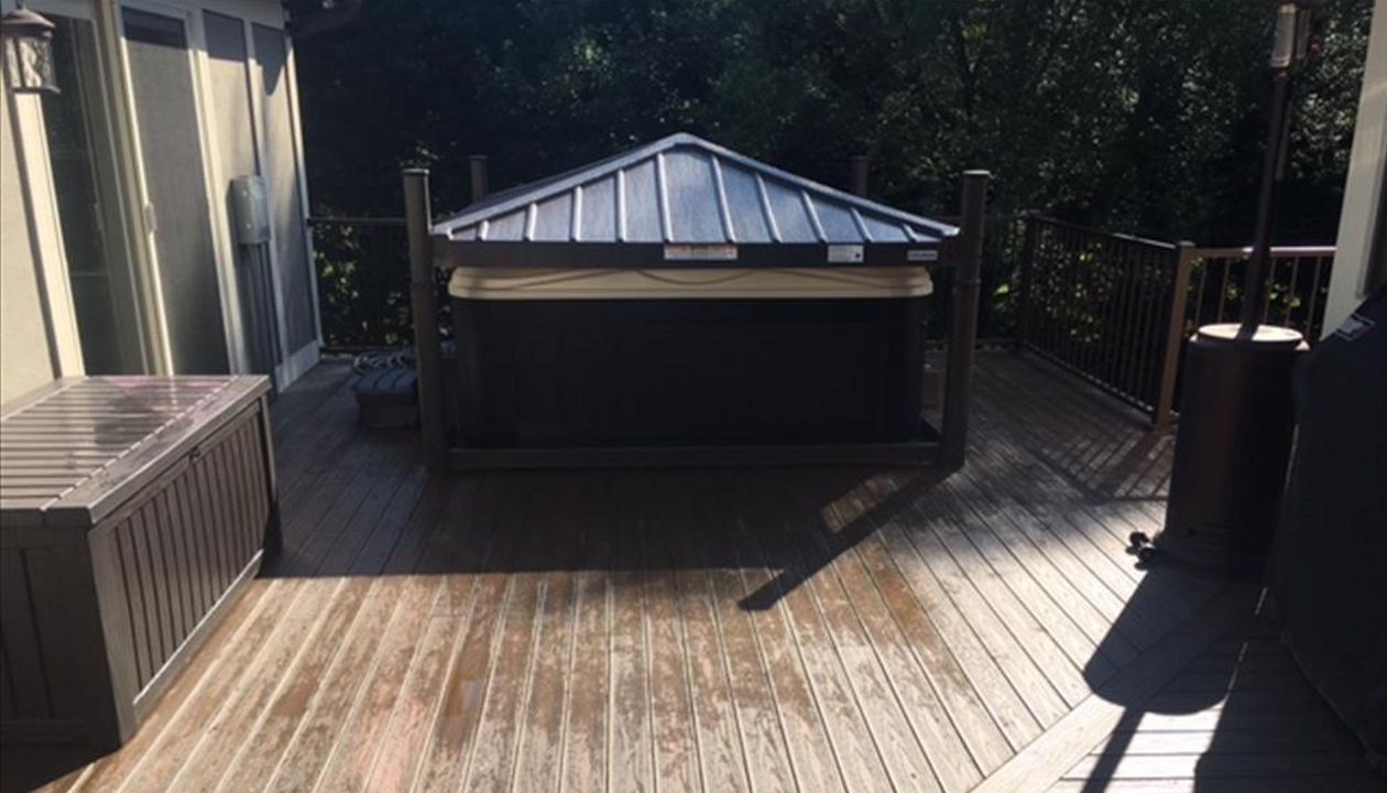 Trex Transcend Spiced Rum Porch provides safe & slip resistant walking surface around this hot tub area.