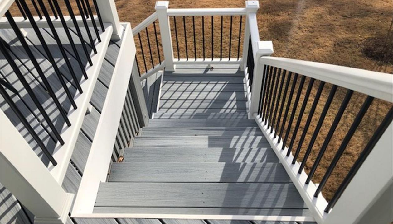 Trex Enhance Naturals Foggy Wharf landing with Transcend white railing is great, code compliant transition to the backyard.