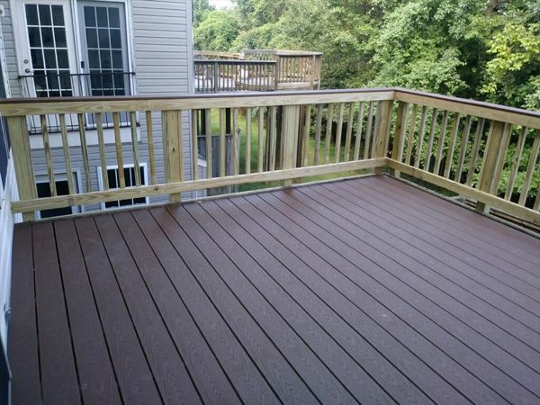 This Trex Select Woodland Brown deck pairs well with a pressure treated pine sweep rail. This very affordable option even includes a matching Woodland Brown rail cap.