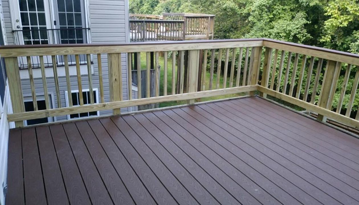 This Trex Select Woodland Brown deck pairs well with a pressure treated pine sweep rail. This very affordable option even includes a matching Woodland Brown rail cap.