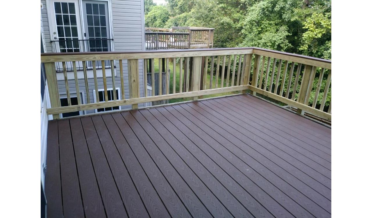 This Trex Select Woodland Brown deck pairs well with a pressure treated pine sweep rail. This very affordable option even includes a matching Woodland Brown rail cap.