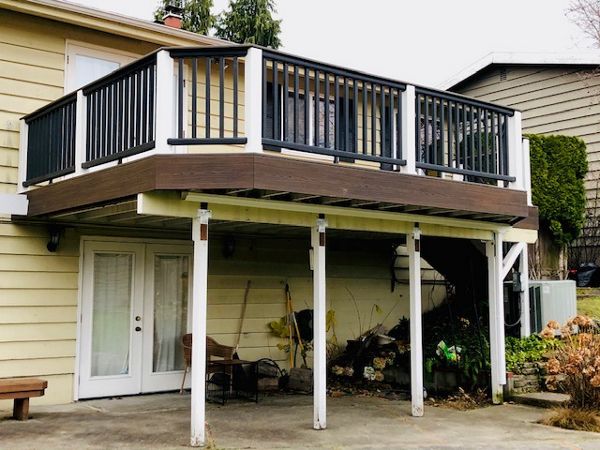 Trex Transcend Tiki Torch body w/ Spice rum boarder. Transcend railing w/ cocktail top cap and rain escape