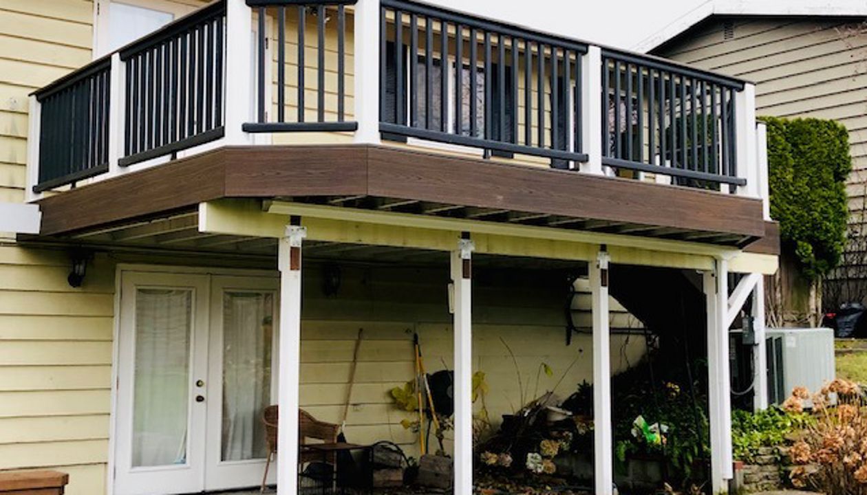 Trex Transcend Tiki Torch body w/ Spice rum boarder. Transcend railing w/ cocktail top cap and rain escape