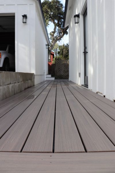Closeup of Rocky Harbour decking with a white base and black trim house
