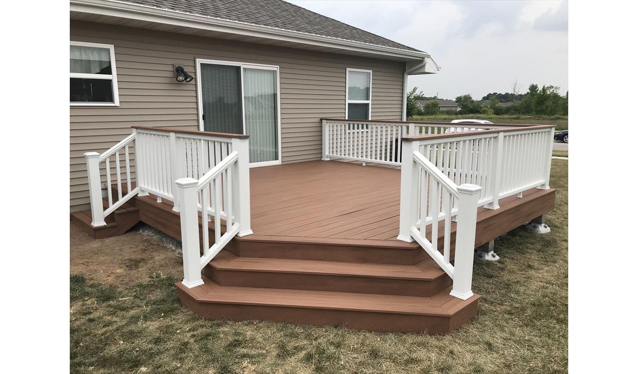 Trex Transcend Tiki Torch decking with Trex Transcend drink rail in white and Tiki Torch. Deck by GE Contracting LLC in DEPere, WI