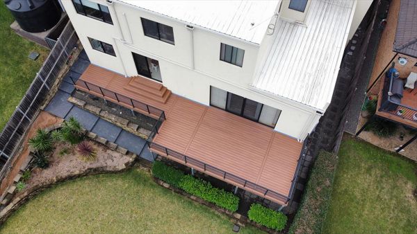 Trex tiki torch with pyramid stairs, deck and stairs on steel frame.