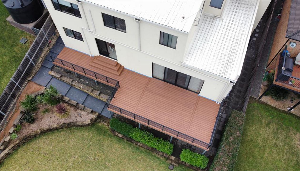 Trex tiki torch with pyramid stairs, deck and stairs on steel frame.