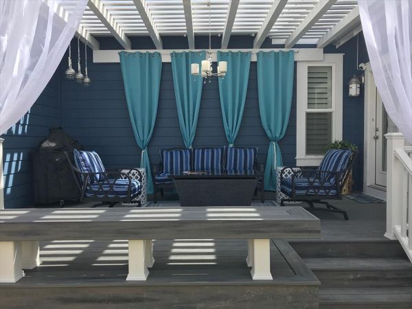 island mist decking and bench with a white timber pergola