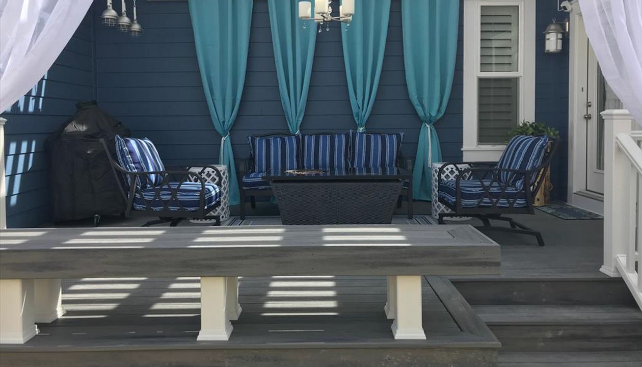 island mist decking and bench with a white timber pergola