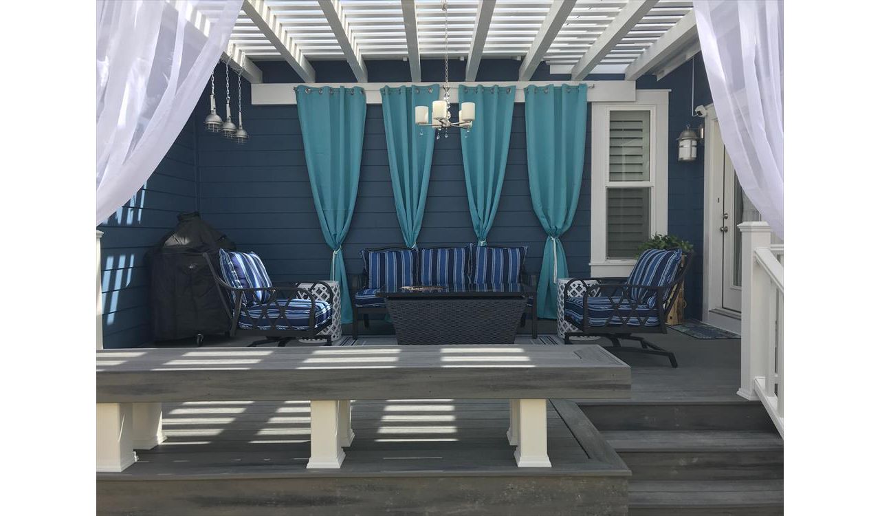 island mist decking and bench with a white timber pergola