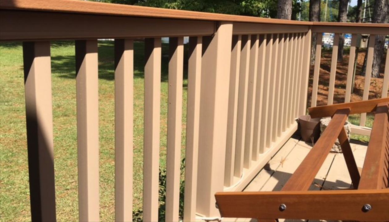 Trex Transcend Rope Swing railing with a Havana Gold cocktail railing cap is both functional & beautiful.