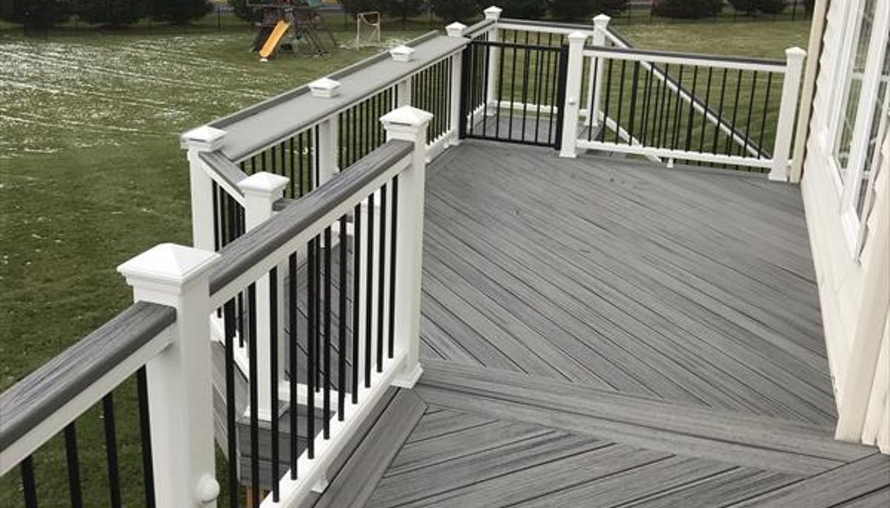 Island Mist decking, picture frame white Transcends cocktail railing and section of Blue Stone on railing for wider cocktail rail.