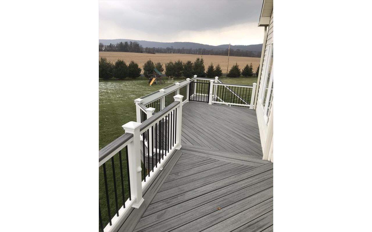 Island Mist decking, picture frame white Transcends cocktail railing and section of Blue Stone on railing for wider cocktail rail.