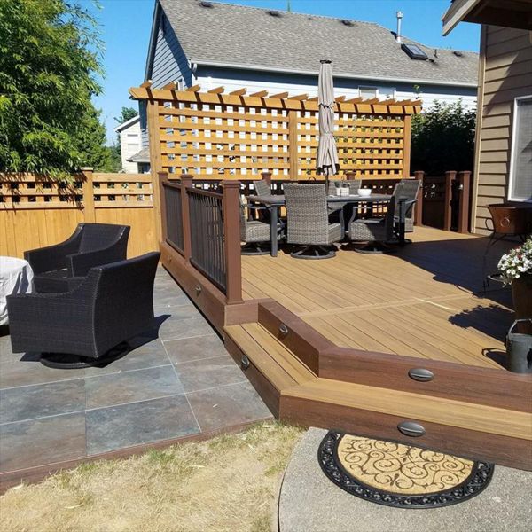 Trex Transcend Tropical Havana Gold with Spiced Rum border and fascia with a lower porcelain slab deck bordered by Trex Transcend Spiced Rum fascia.