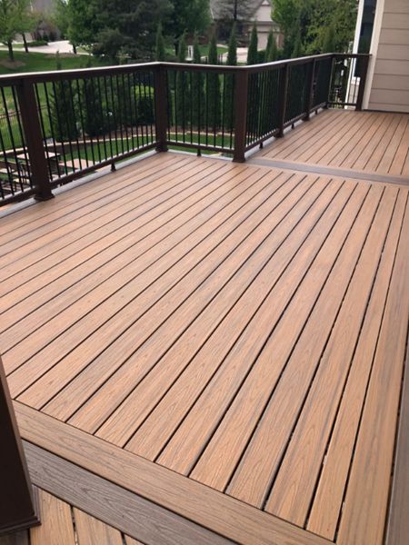 Trex Transcend Havana Gold Decking w/ Spiced Rum Border, Transcend Railing, Rain Escape, and Elevations Structure