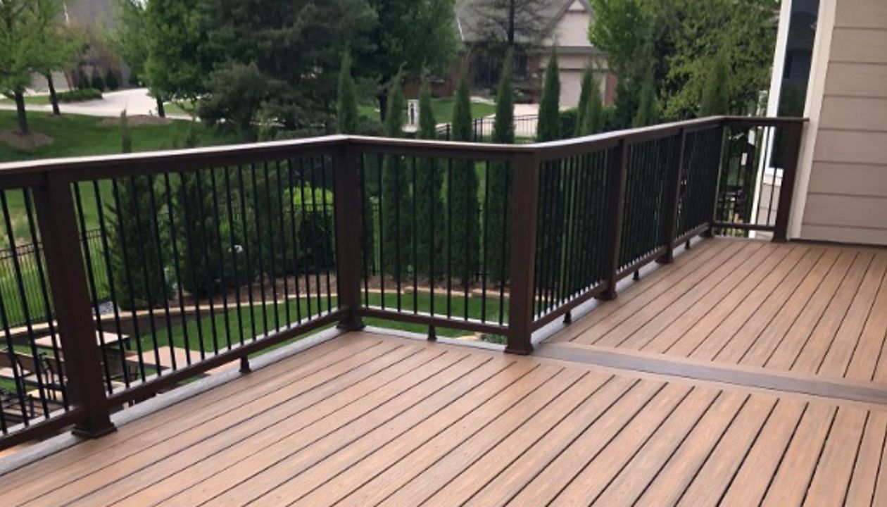 Trex Transcend Havana Gold Decking w/ Spiced Rum Border, Transcend Railing, Rain Escape, and Elevations Structure