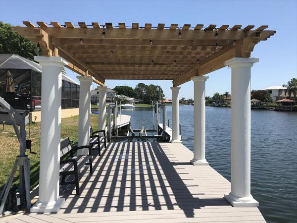 Water views are great. They are even better with Trex composite decking which allows you to spend more time enjoying your dock than maintaining it. Plus the shade from this cyress pergola is just enough to allow this area to be enjoyed all day long!