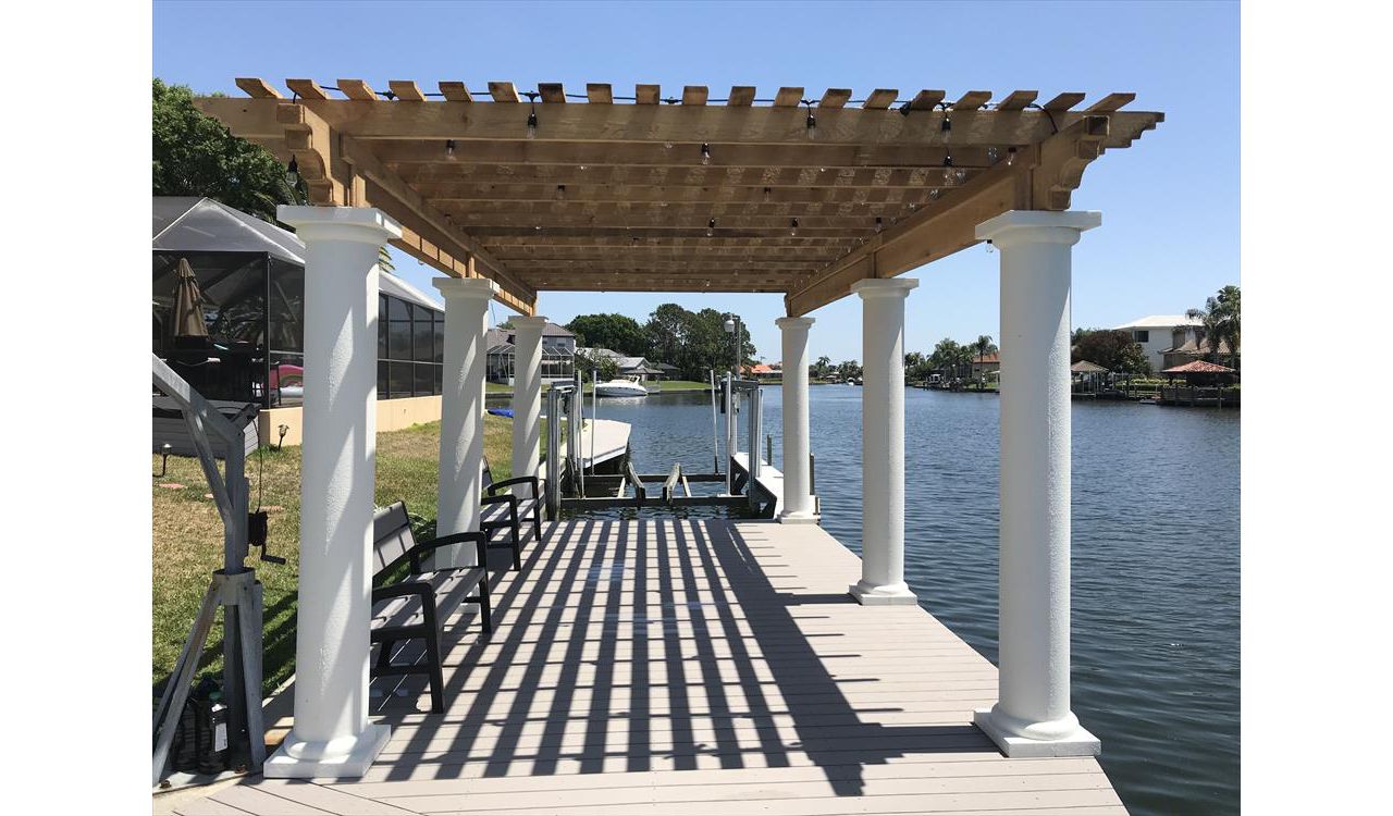 Water views are great. They are even better with Trex composite decking which allows you to spend more time enjoying your dock than maintaining it. Plus the shade from this cyress pergola is just enough to allow this area to be enjoyed all day long!