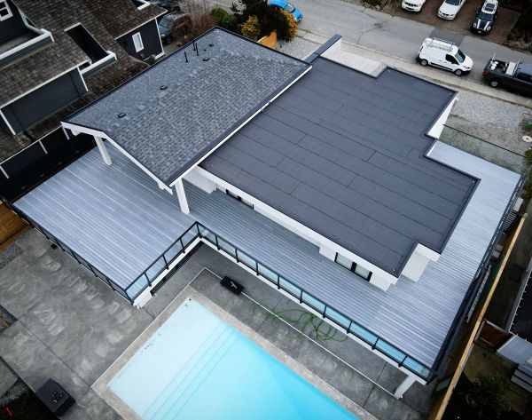 Foggy Wharf field. This rooftop deck floats on a sleeper system above granular torch down membrane allowing the roof system to work exactly as intended while provided a massive amount of usable deck space.