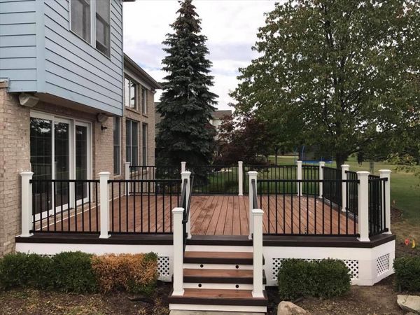 Tiki torch with vintage lantern border and picture framed maintenance free lattice